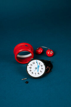 disassembling a red alarm clock