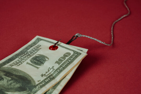 fake dollar bills on a fishhook