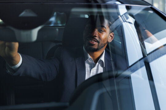 Driver getting comfortable while starting a test drive