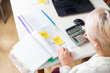 Accountant counts on a calculator