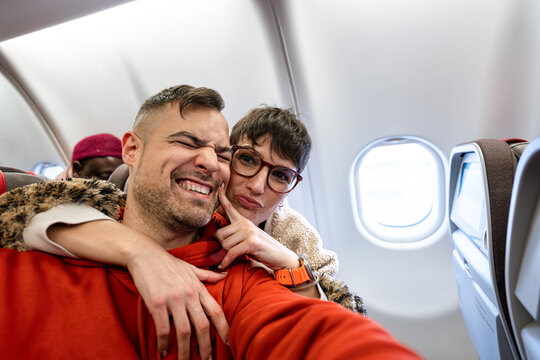 Traveler couple taking selfies.