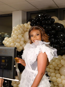 Model smiles while showing off make up 