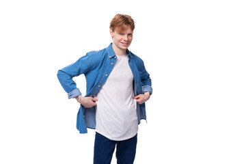 young man with red hair in a blue shirt over a white t-shirt with a mockup for advertising