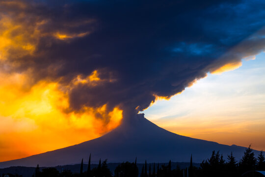 Sunset with Popocatepetl volcano fumaroles