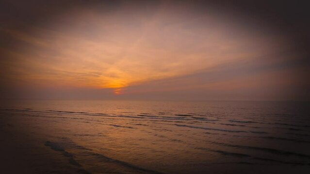 Aerial view of sunset, sandy beaches and ocean in Blankenberge, Flanders region, Belgium.