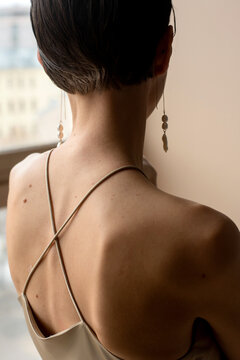 Back of a woman with short haircut
