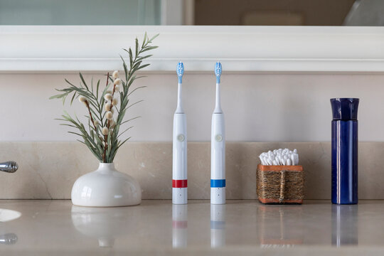 Electric Toothbrush still life with cotton swabs