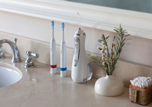 Electric Toothbrush  sink  still life water flosser 