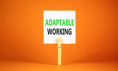 Adaptable working symbol. Concept words Adaptable working on beautiful white paper on wooden...