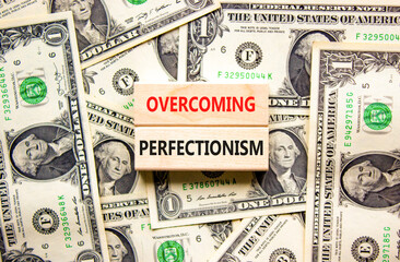 Overcoming perfectionism symbol. Concept words Overcoming perfectionism on beautiful wooden block....