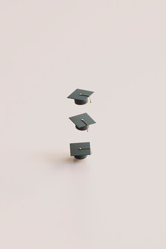 Three Graduation Caps in Vertical Alignment