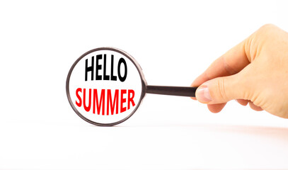 Hello summer symbol. Concept words Hello summer in beautiful magnifying glass. Beautiful white...