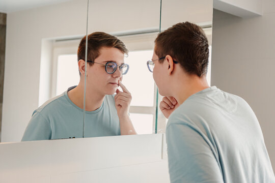 Teen looking in the mirro