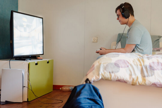 Teenage gamer conquering virtual realms