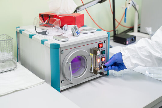 Researcher Using Plasma Surface Treatment Machine