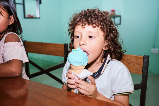 Latino boy enjoying an ice cream