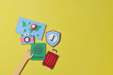 The shield with travel items. Travel insurance concept.