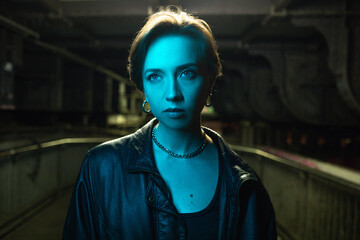 Blue-Tinted Woman in Urban Underground Setting