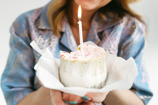 Crop Woman Holding Birthday Cupcake With Lit Candle
