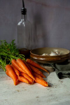 Carrots and garlic with kitchenware
