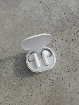 White wireless ear buds