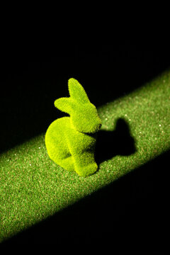 Green grass rabbit on artificial grass. Easter concept