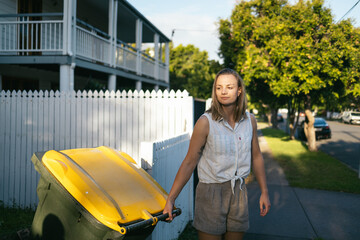 Woman taking out the trash