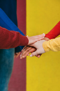 Hands united in colorful solidarity
