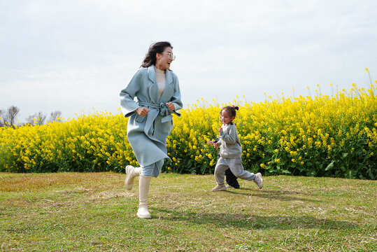 happy asian kids running in the spring day