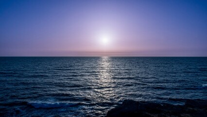 Fototapeta premium Scenic view of sunset over the coastline