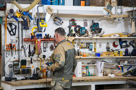 Craftsman working at a well-organized tool bench 