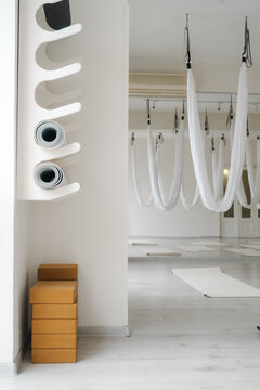 Aerial yoga exercise equipment and bricks in studio