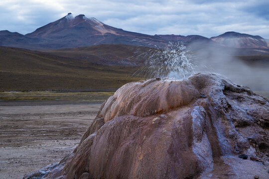 Water splashing out of geyser in el tatio geothermal field