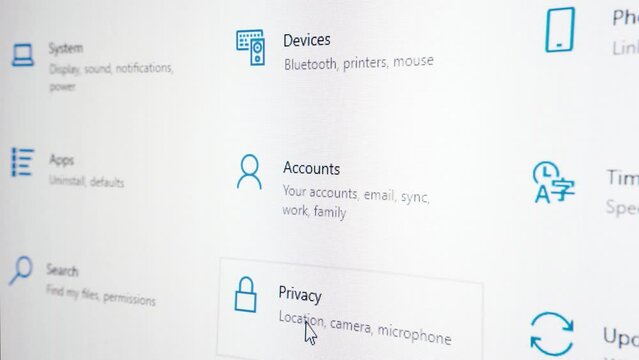 Mouse pointer moving over various setting icons in Windows 10. Screen close up