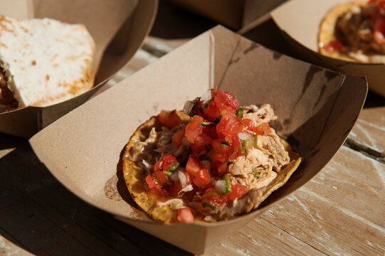 eco friendly cardboard trays with freshly made food for an event