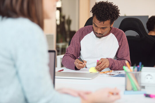 student Focused on Writing Notes