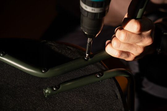  handyman assembling a chair in a new home