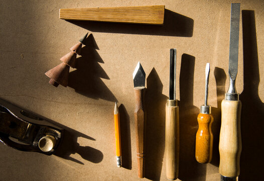 Professional Woodworking Tools Laid Out on a Workbench 