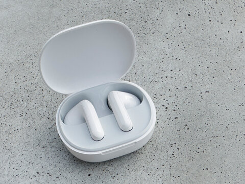 White wireless ear buds