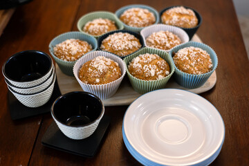 a plate of muffins with powdered sugar on top
