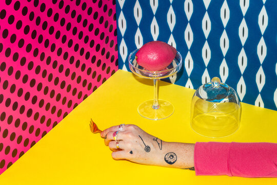 Conceptual colorful still life with an artful pink dessert