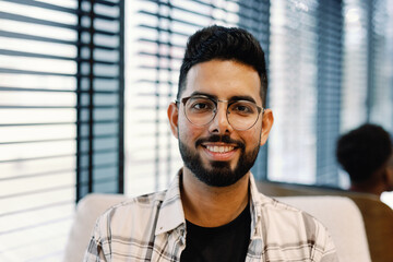Friendly Entrepreneur with Welcoming Smile in Office