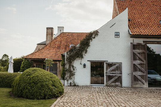 rustic country house with cobblestone pavement