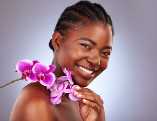 Beauty, flower and portrait of black woman in studio with natural, health and facial routine....