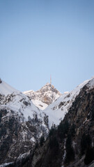 Mountain peak glowing in dawn's light, symbolizing nature's beauty and tranquility at sunrise