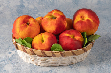 colorful and appetizing nectarines in a wicker basket