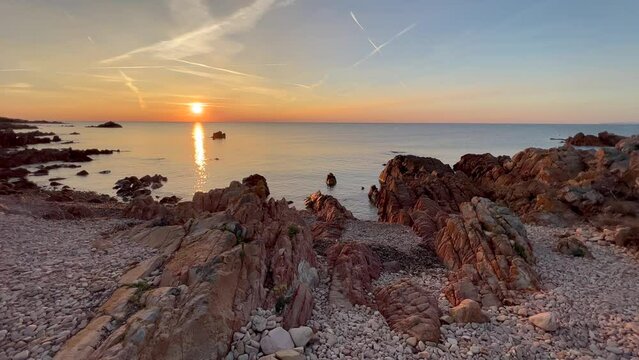 Beautiful scenery of Conca del Tramonto at sunrise with calm sea in Sardinia, Italy