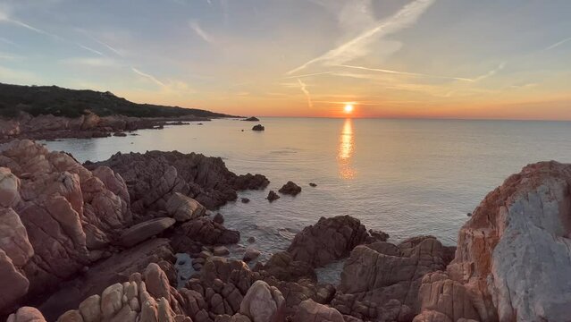 Beautiful view of Conca del Tramonto at sunrise with calm sea in Sardinia, Italy
