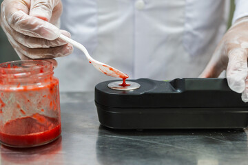 Worker using Digital Refractometer