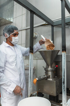 Man Processing Peanuts